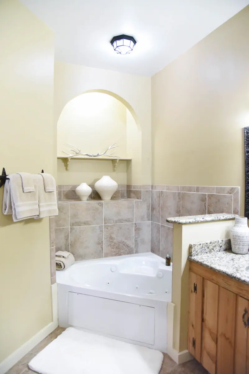bathroom with large tub 