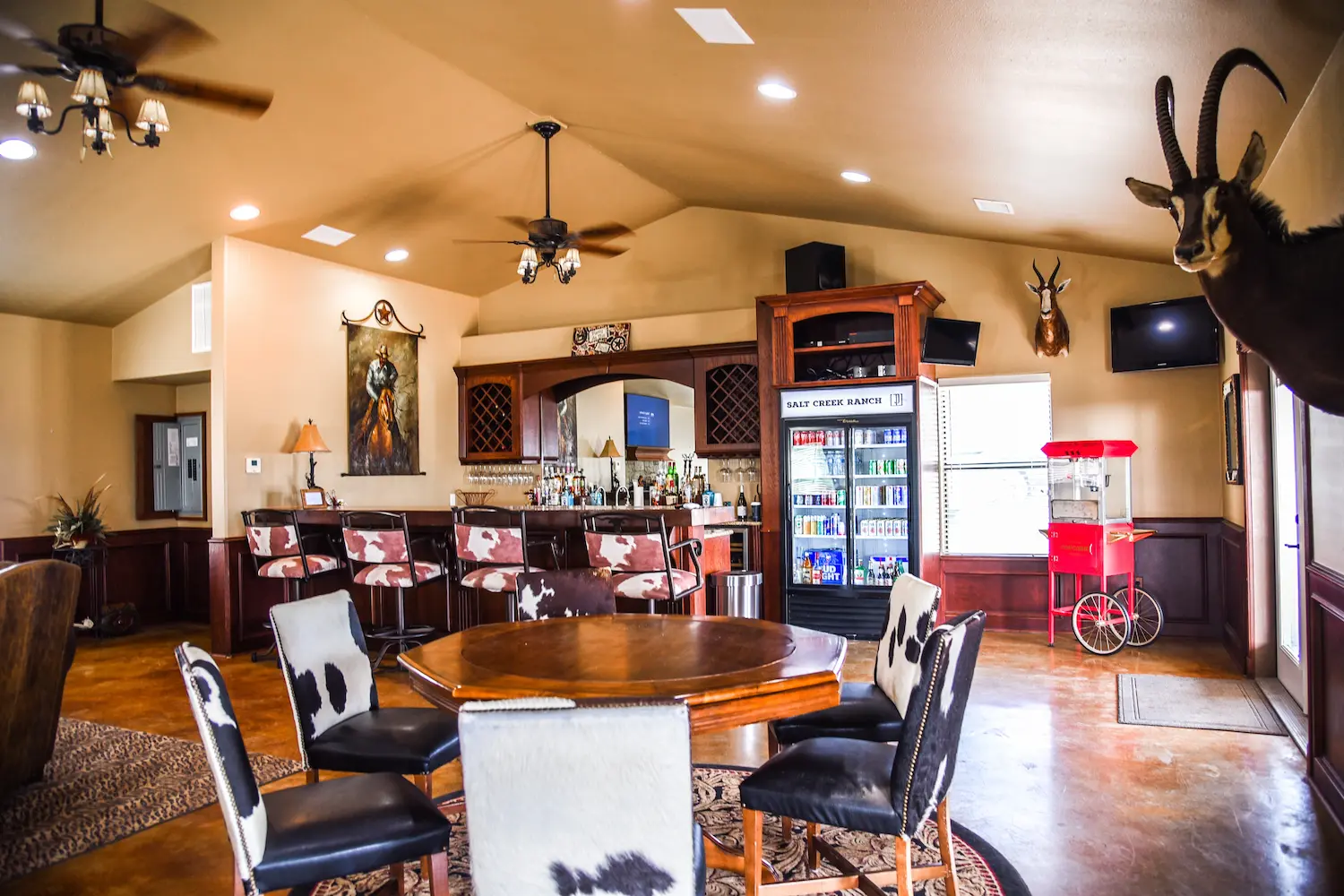 Lodge bar with animal skin chairs and rustic decor
